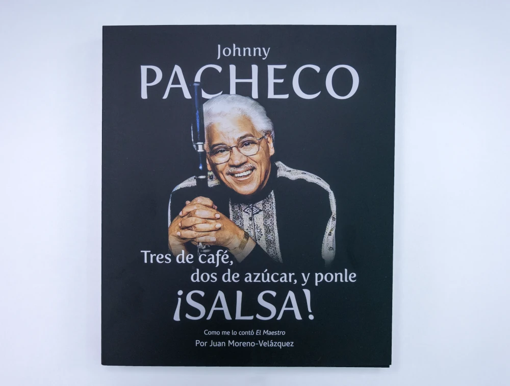 Portada de la biografía de Johnny Pacheco, auspiciada por Banreservas.